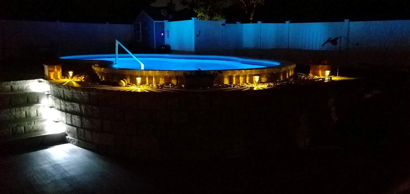 semi-inground pool at night